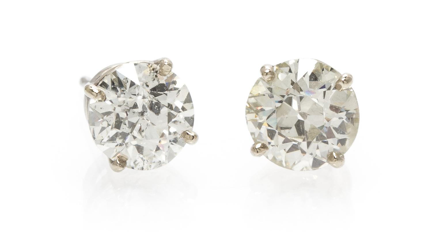 A Pair of 14 Karat White Gold Diamond Stud Earrings 0.65 dwts.