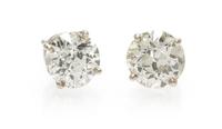 A Pair of 14 Karat White Gold Diamond Stud Earrings 0.65 dwts.