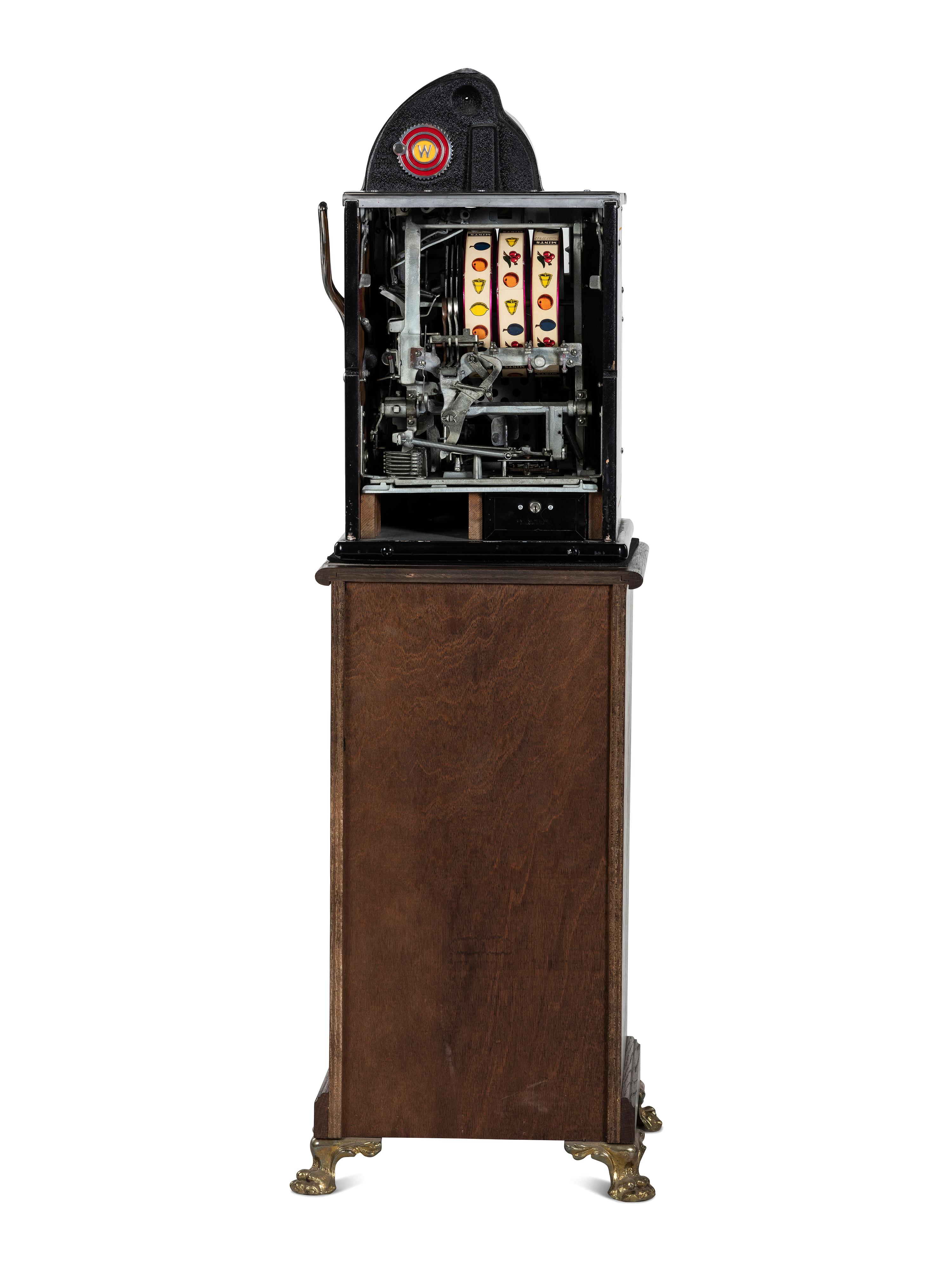 A 5 Cent Rol-A-Top Twin Jackpot Slot Machine on Reverse Printed Glass Inset Golden Nugget Stand