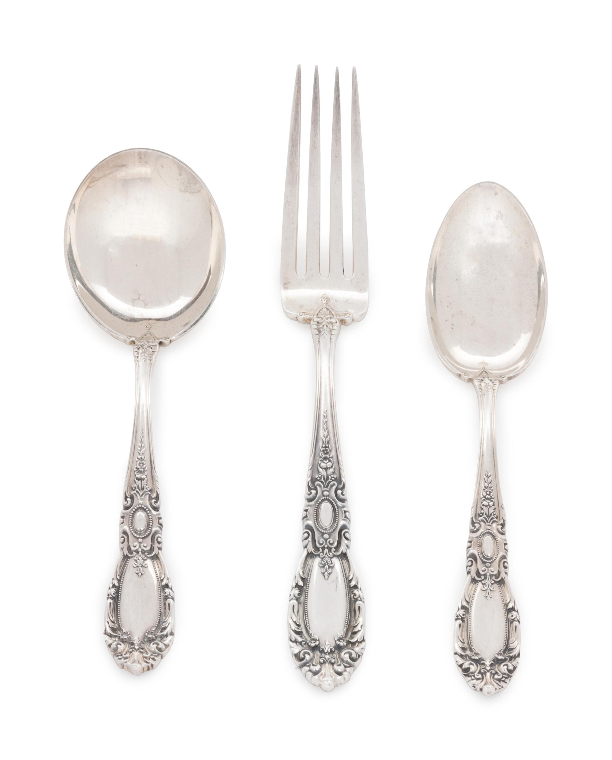 King Richard pattern, comprising: 5 butter spreaders with stainless steel blades 12 dinner forks 12 salad forks 1 meat fork 1 lemon fork 1 pickle fork 2 serving spoons 24 teaspoons 12 soup spoons 1 fruit spoon 12 iced tea spoons 2 youth forks 85 pieces total.