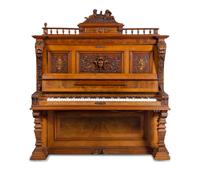 A German Carved Walnut Upright Player Piano and Upholstered Bench