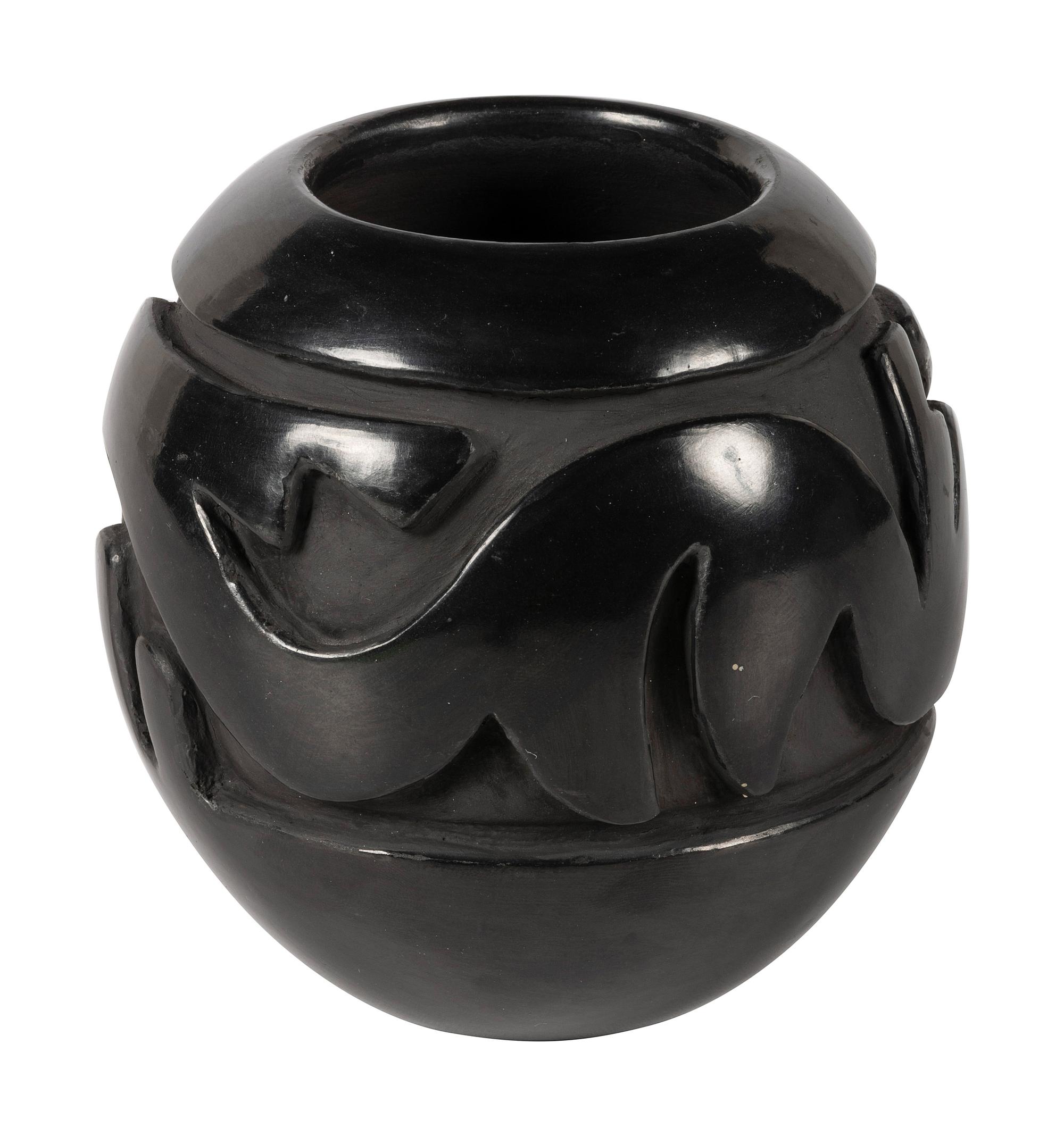 Deeply Carved Blackware Pottery Jar, with Avanyu