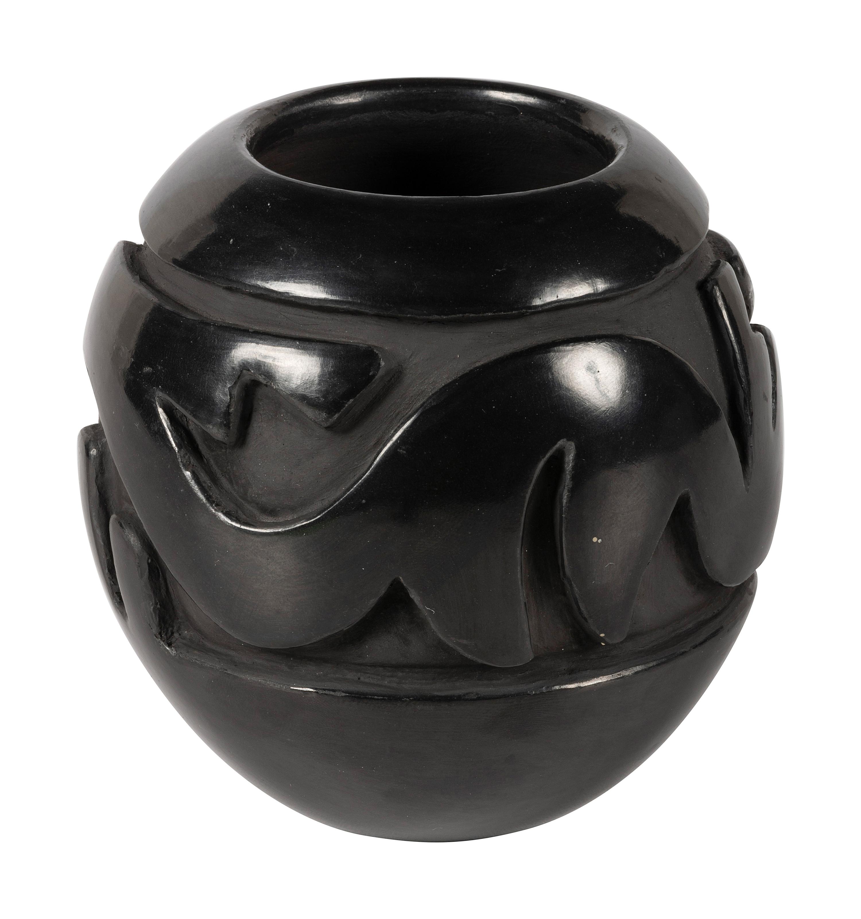 Deeply Carved Blackware Pottery Jar, with Avanyu