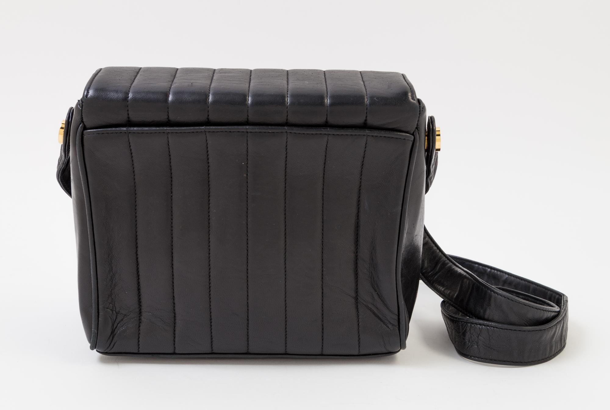 A Chanel Black Lambskin Vertical Quilt Flap Shoulder Bag, 7.5" x 7" x 2". Strap drop: 19".