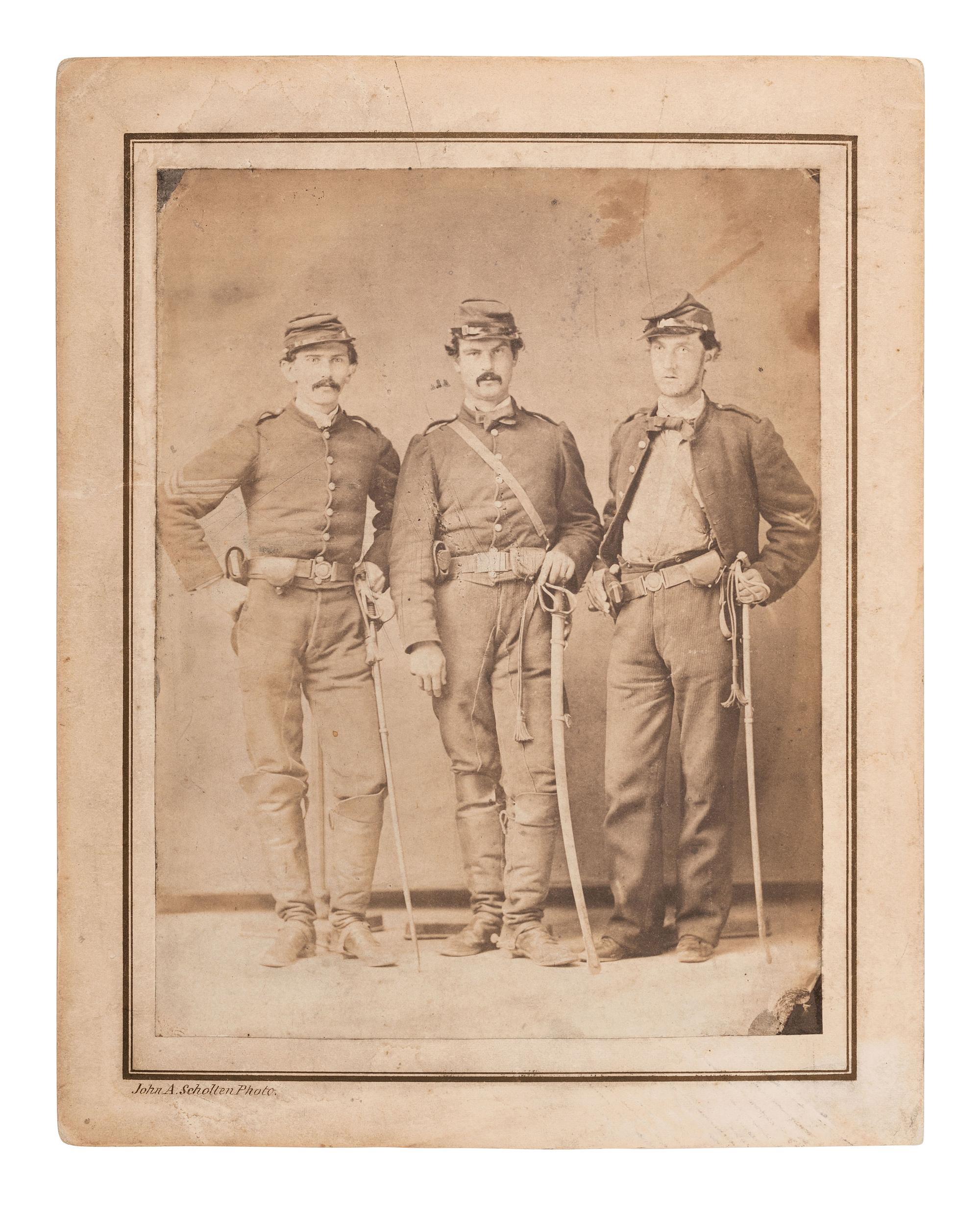 [CIVIL WAR] SCHOLTEN, J.A. Salted paper print of 3 cavalrymen with revolvers & sabers. St. Louis.