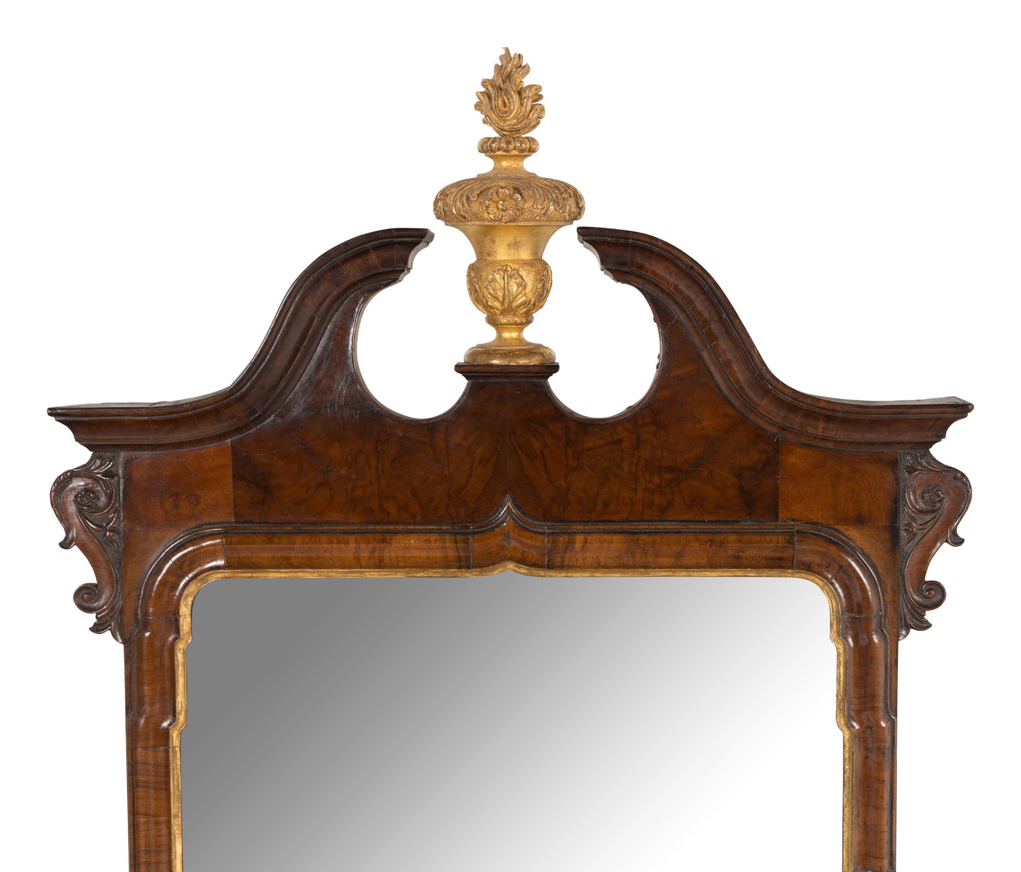 A George I Walnut and Parcel-Gilt Mirror