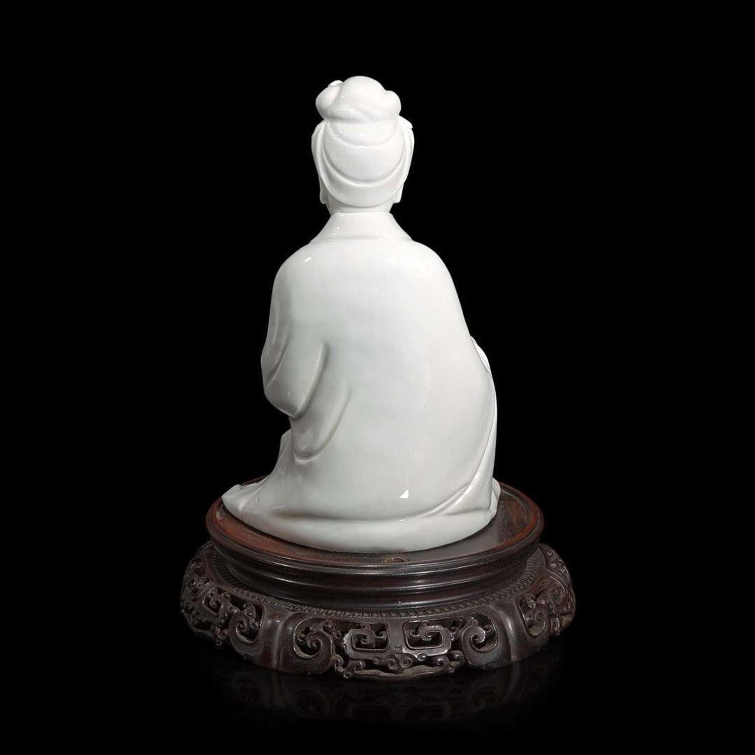 A Chinese blanc de Chine figure of Guanyin seated, with scroll 白瓷持卷轴观音像 Boji Yuren mark ?????