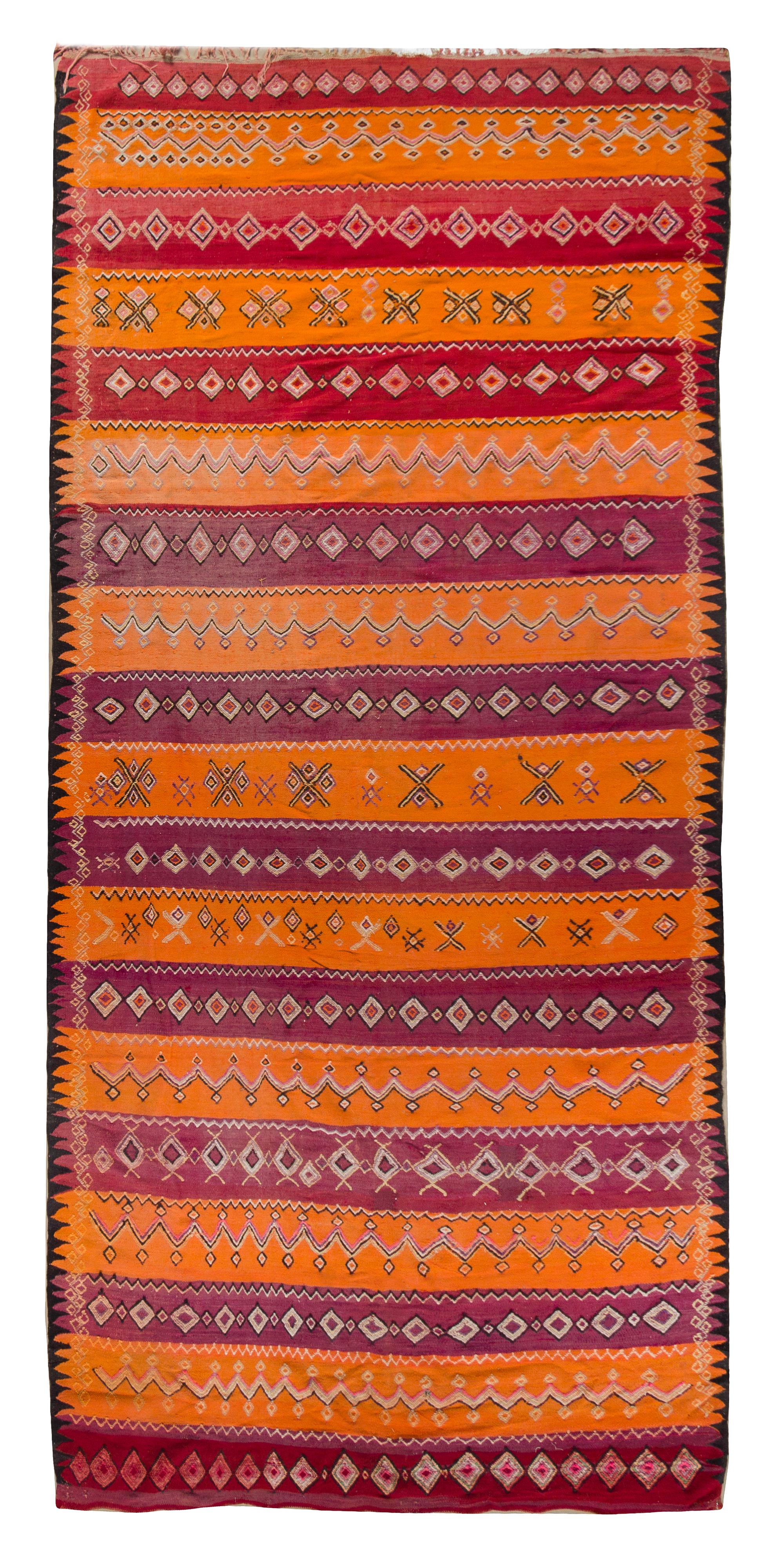 An Afghan Wool Rug 11 feet 4 inches x 5 feet 9 3/4 inches. — 20TH CENTURY