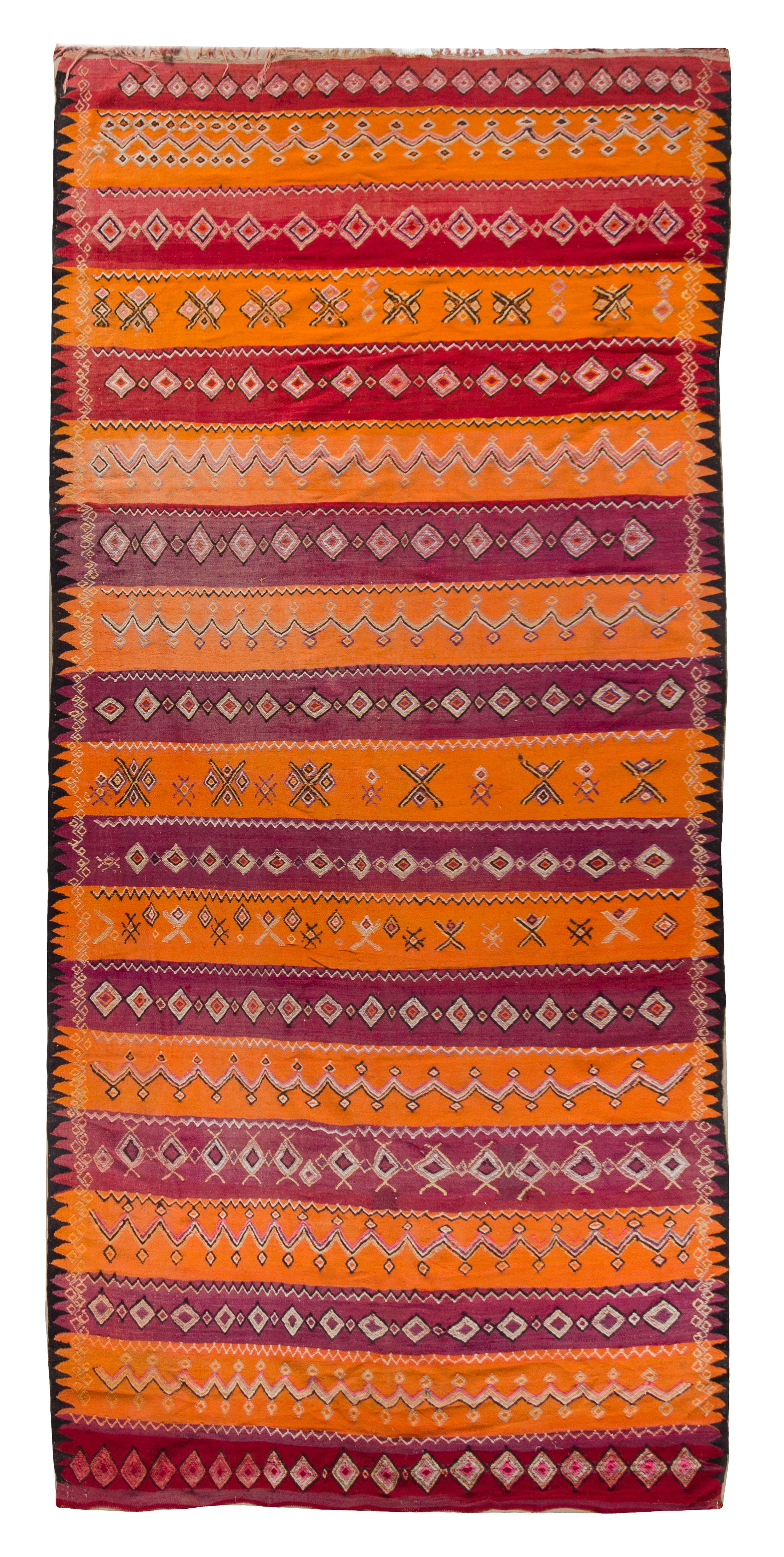 An Afghan Wool Rug 11 feet 4 inches x 5 feet 9 3/4 inches. — 20TH CENTURY