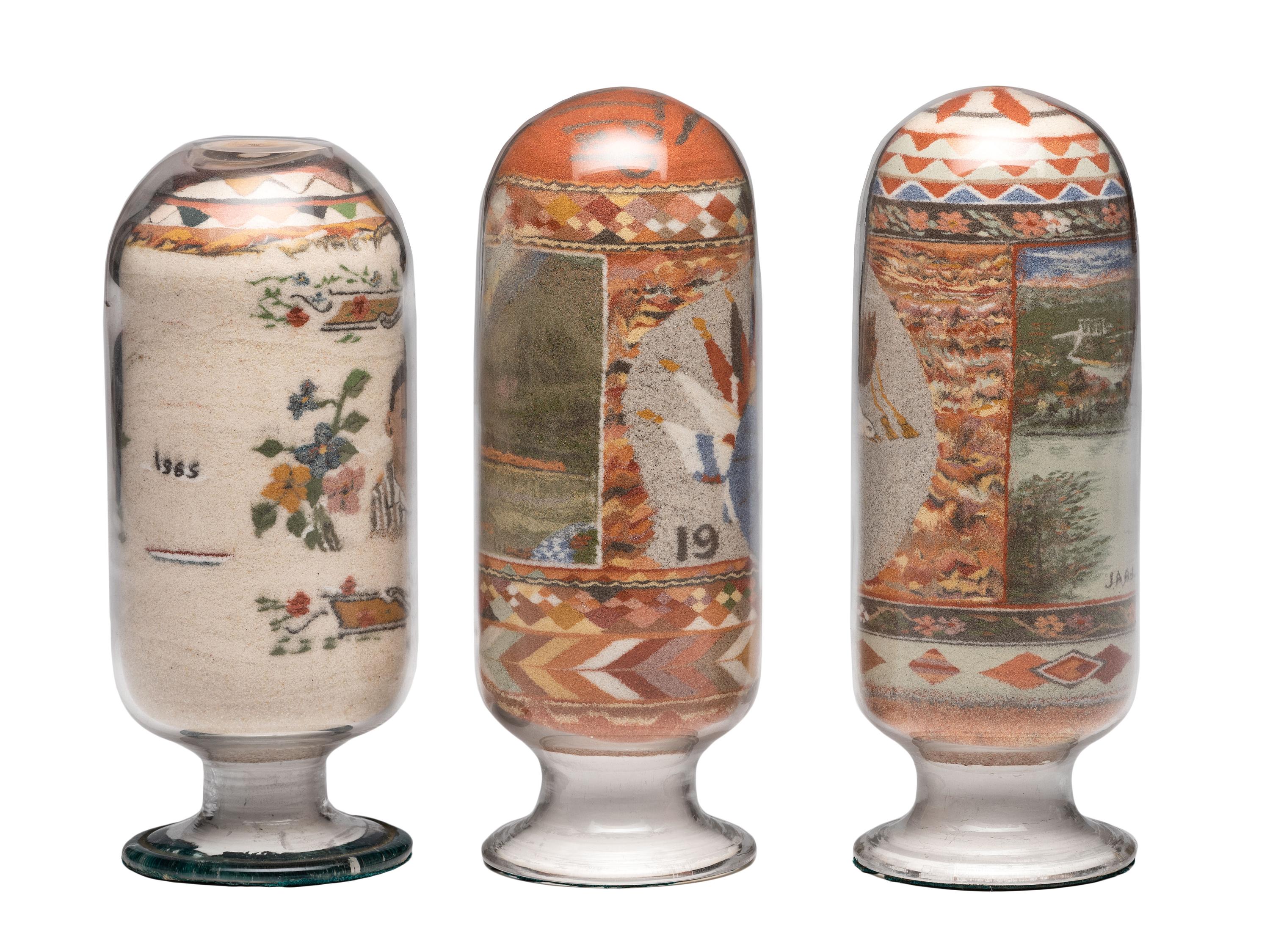 A Collection of John A. Adams Sand Art Bottles, Along with Custom Box and Unused Bottle