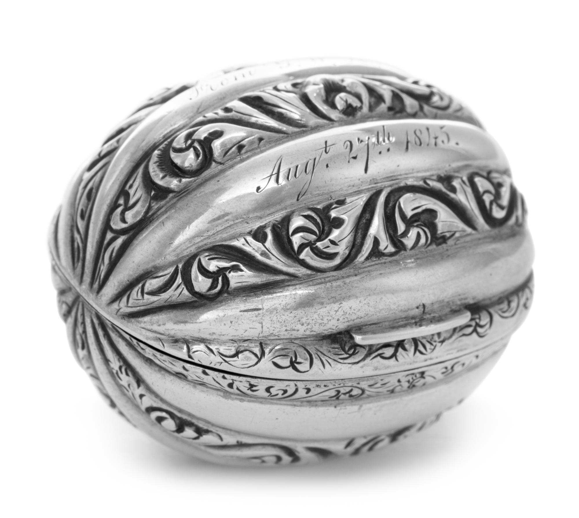 A Victorian Silver Nutmeg Grater, John Taylor & John Perry, Birmingham, 1844, of nutmeg form, the case engraved with S-scrolls, the hin