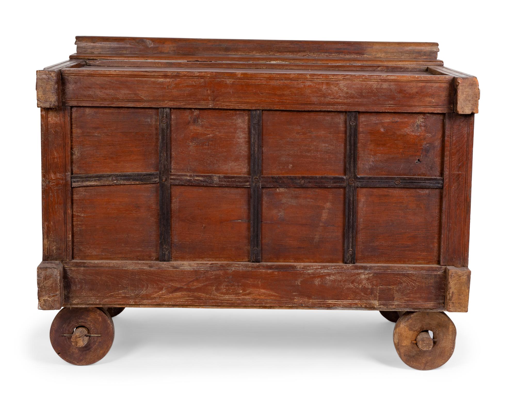 An Indian Carved Wood Traveling Trunk on Wheels — 19TH/20TH CENTURY