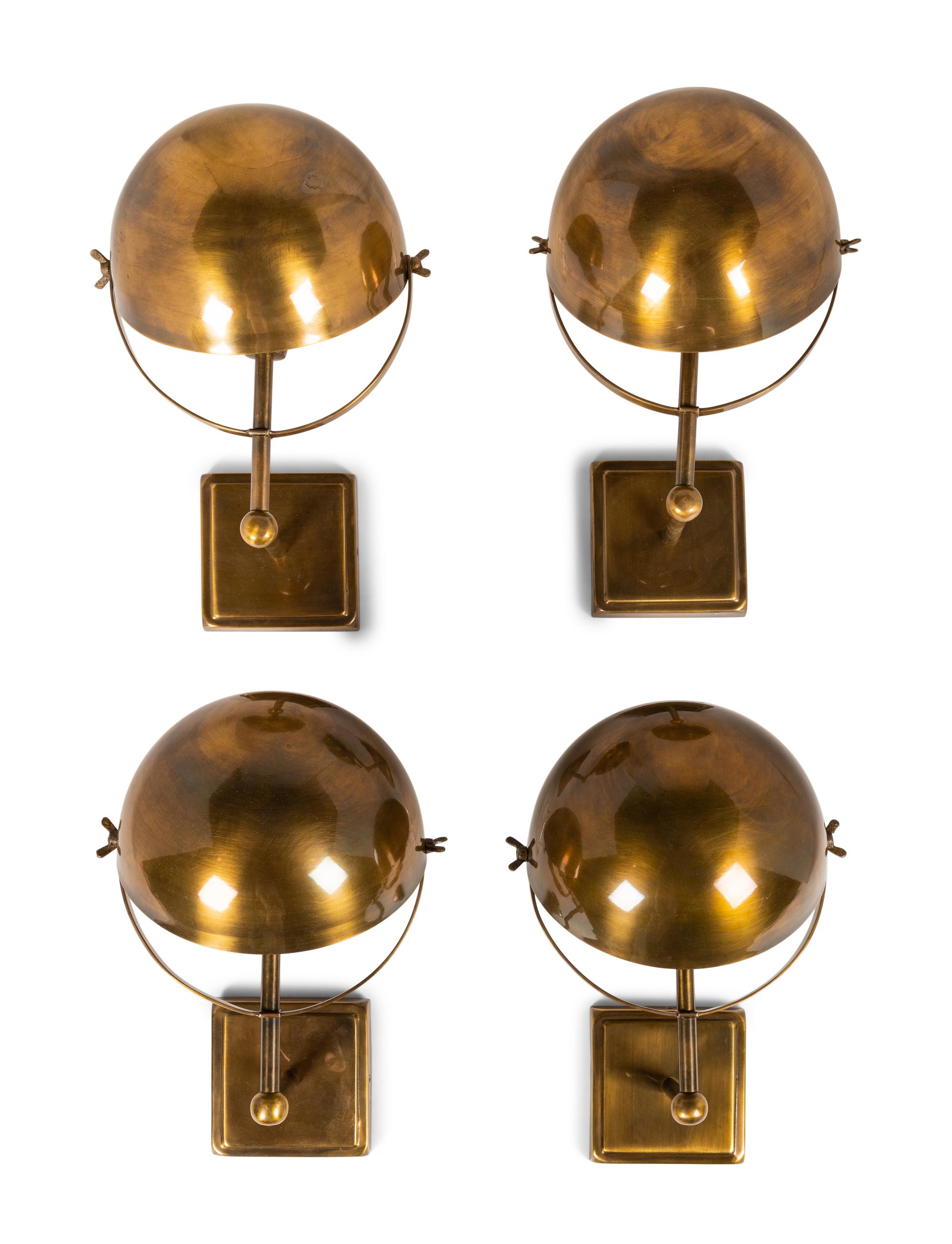 A Set of Four Brass Wall Lights