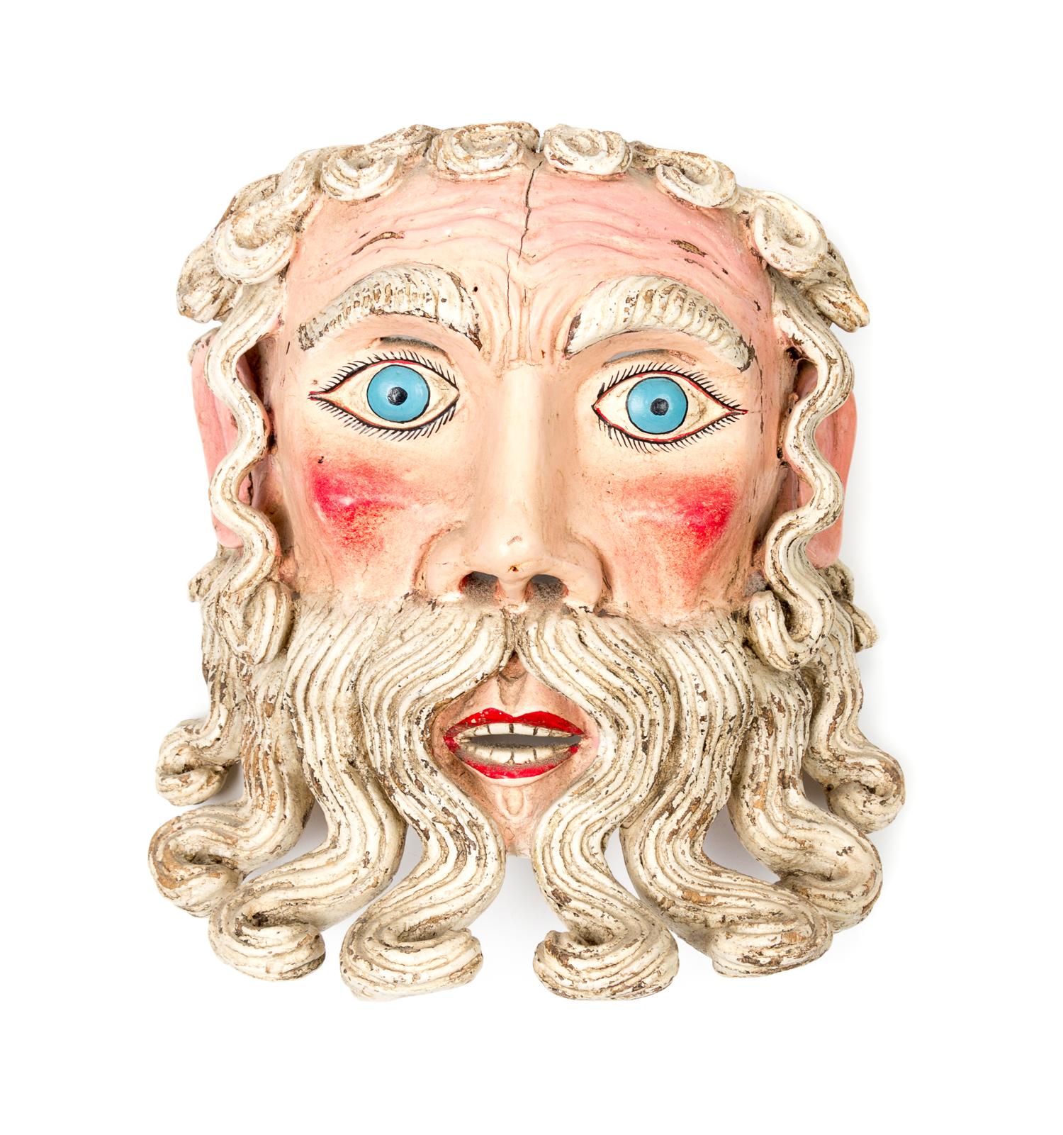 A Mexican Polychromed Wood Mask Height 10 1/4 inches.