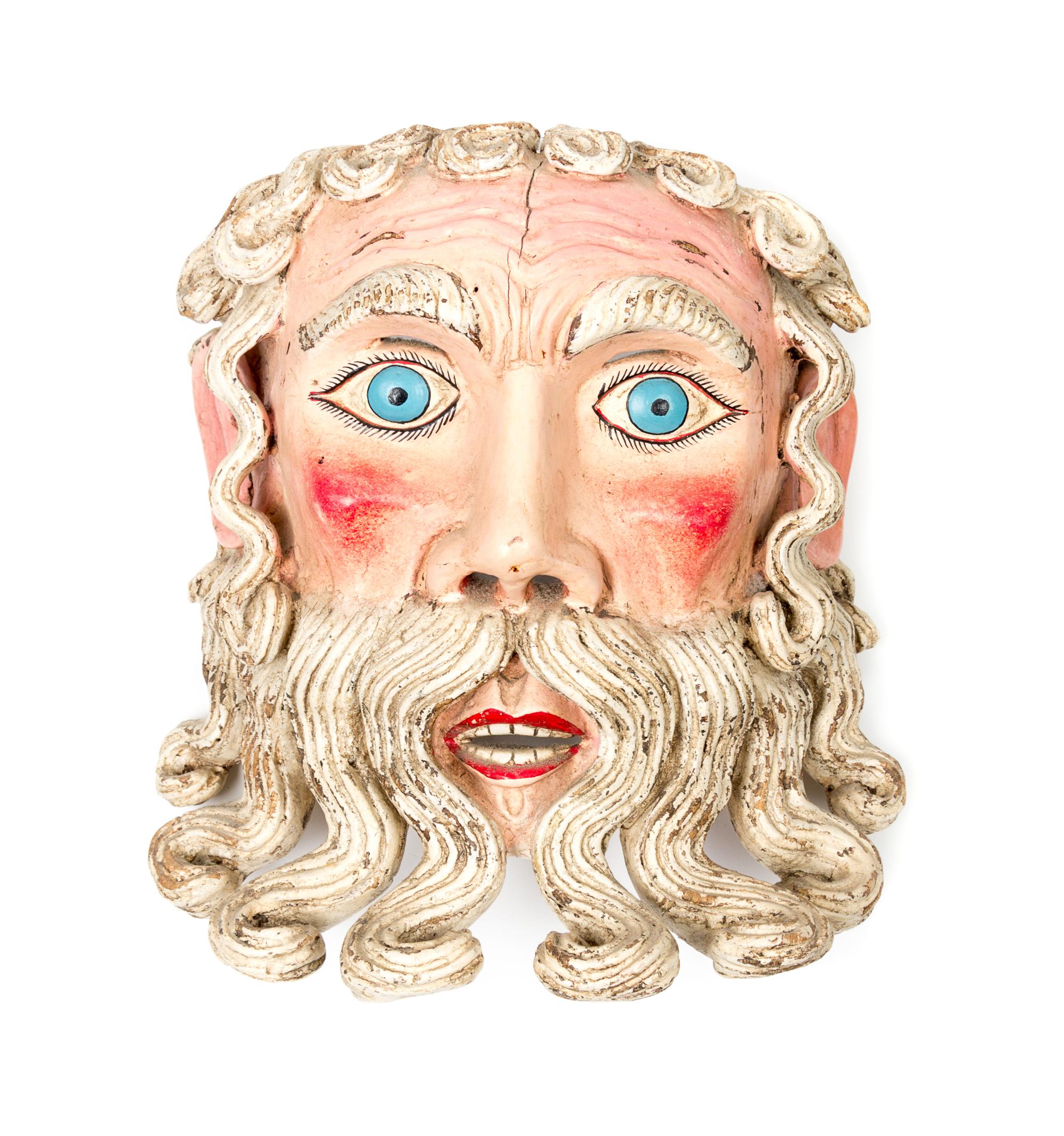 A Mexican Polychromed Wood Mask Height 10 1/4 inches.
