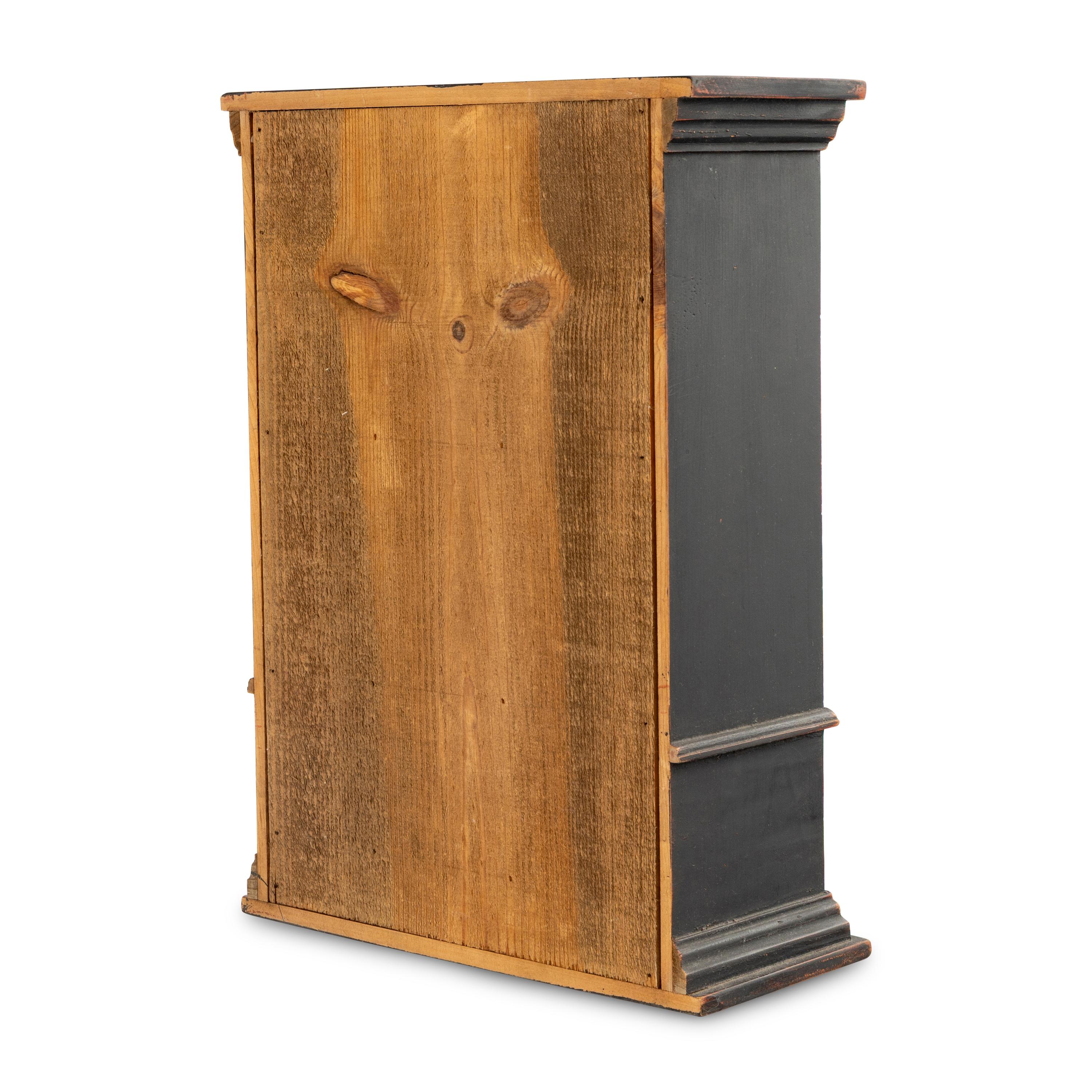 A Continental Ebonized Diminutive Vitrine Cabinet