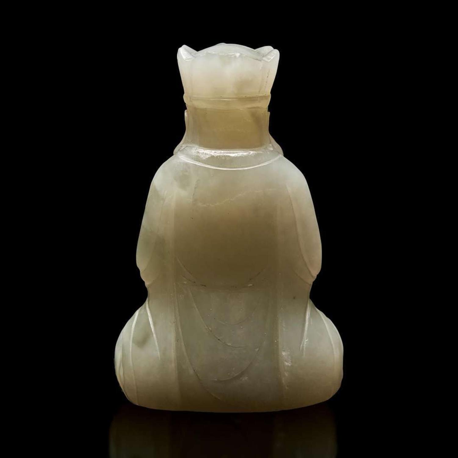 A small Chinese carved pale celadon jade figure of a crowned bodhisattva 青白玉戴冠菩薩