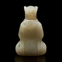 A small Chinese carved pale celadon jade figure of a crowned bodhisattva 青白玉戴冠菩薩