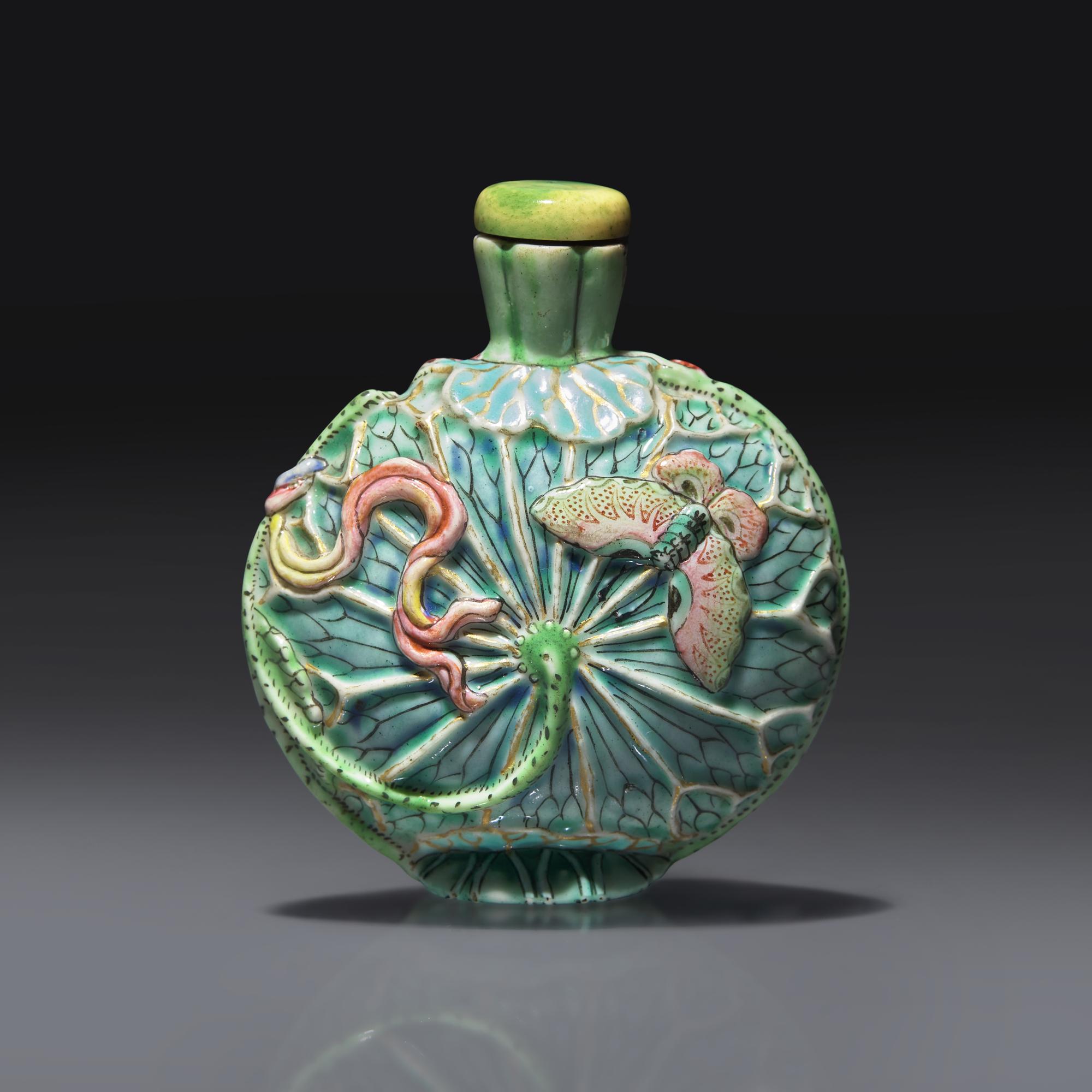 A Chinese Molded and Enameled Porcelain "Lotus and Butterflies" Snuff Bottle, Qing Dynasty, Circa 1780-1850 — 1780-1850年 粉彩模印荷葉蝴蝶紋鼻煙壺