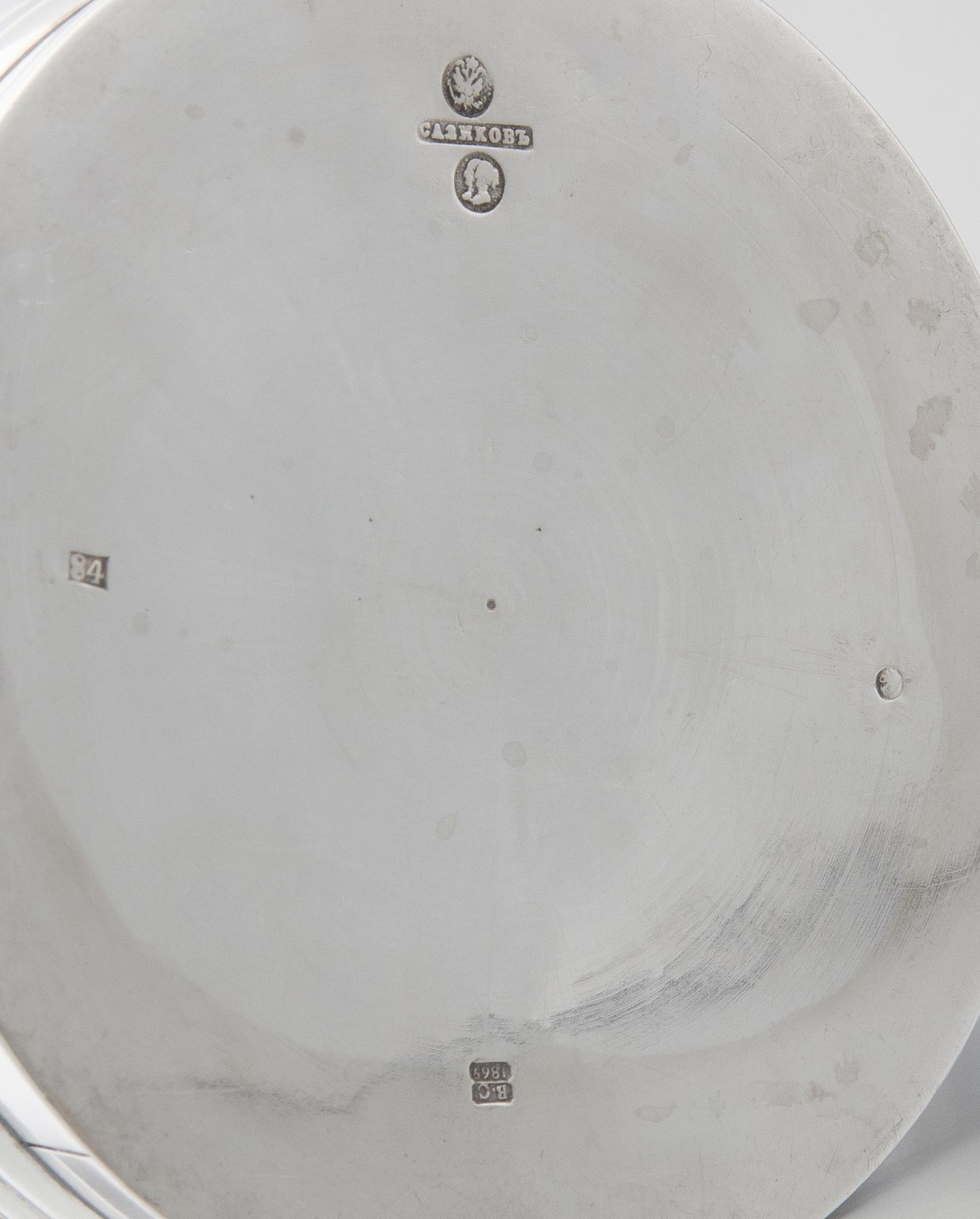 A Russian Silver Tankard, Mark of Pavel Sazikov with Imperial Warrant, Assay Mark B.C., St. Petersburg, 1869, the lid and body worked t