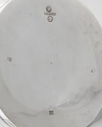 A Russian Silver Tankard, Mark of Pavel Sazikov with Imperial Warrant, Assay Mark B.C., St. Petersburg, 1869, the lid and body worked t