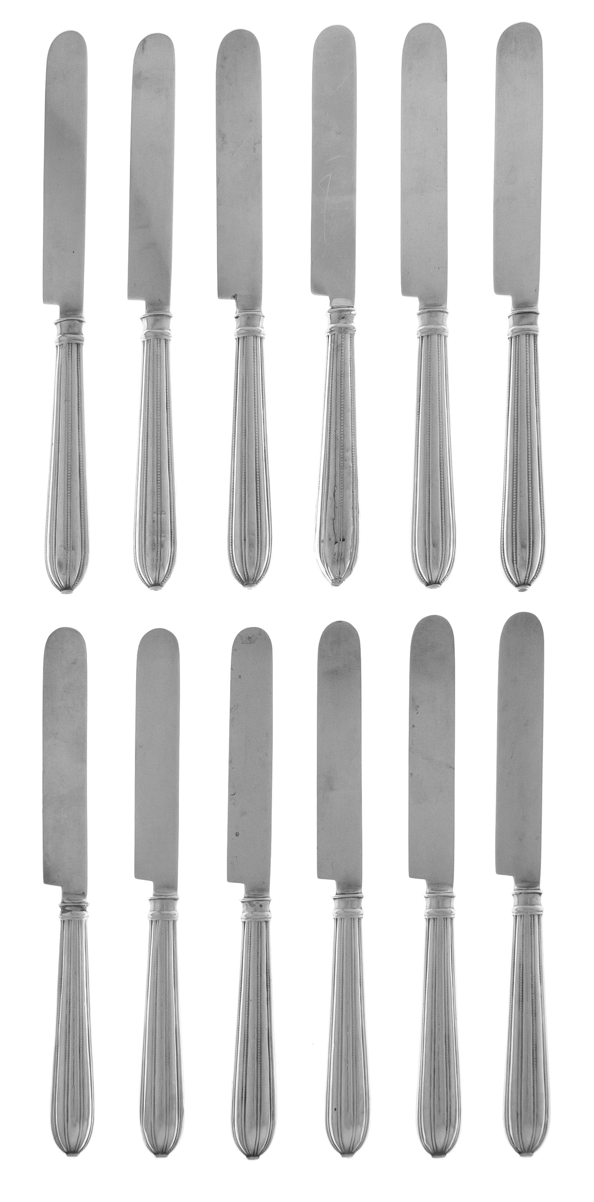 A Set of Twelve American Silver Fruit Knives, Mid 20th Century, with lobed beaded handles.