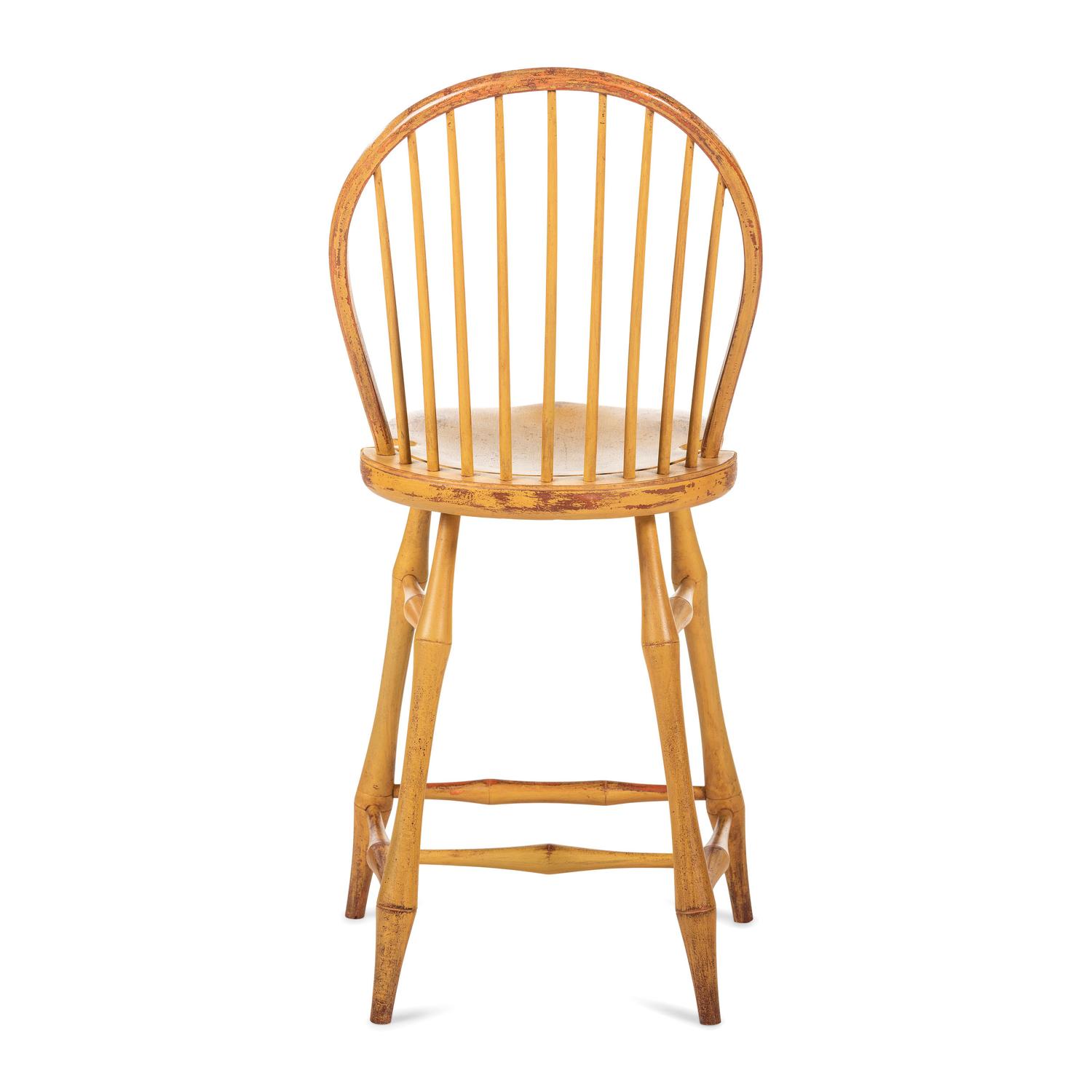 A Yellow Painted Bow Back Compass-Seat Windsor Tall Chair