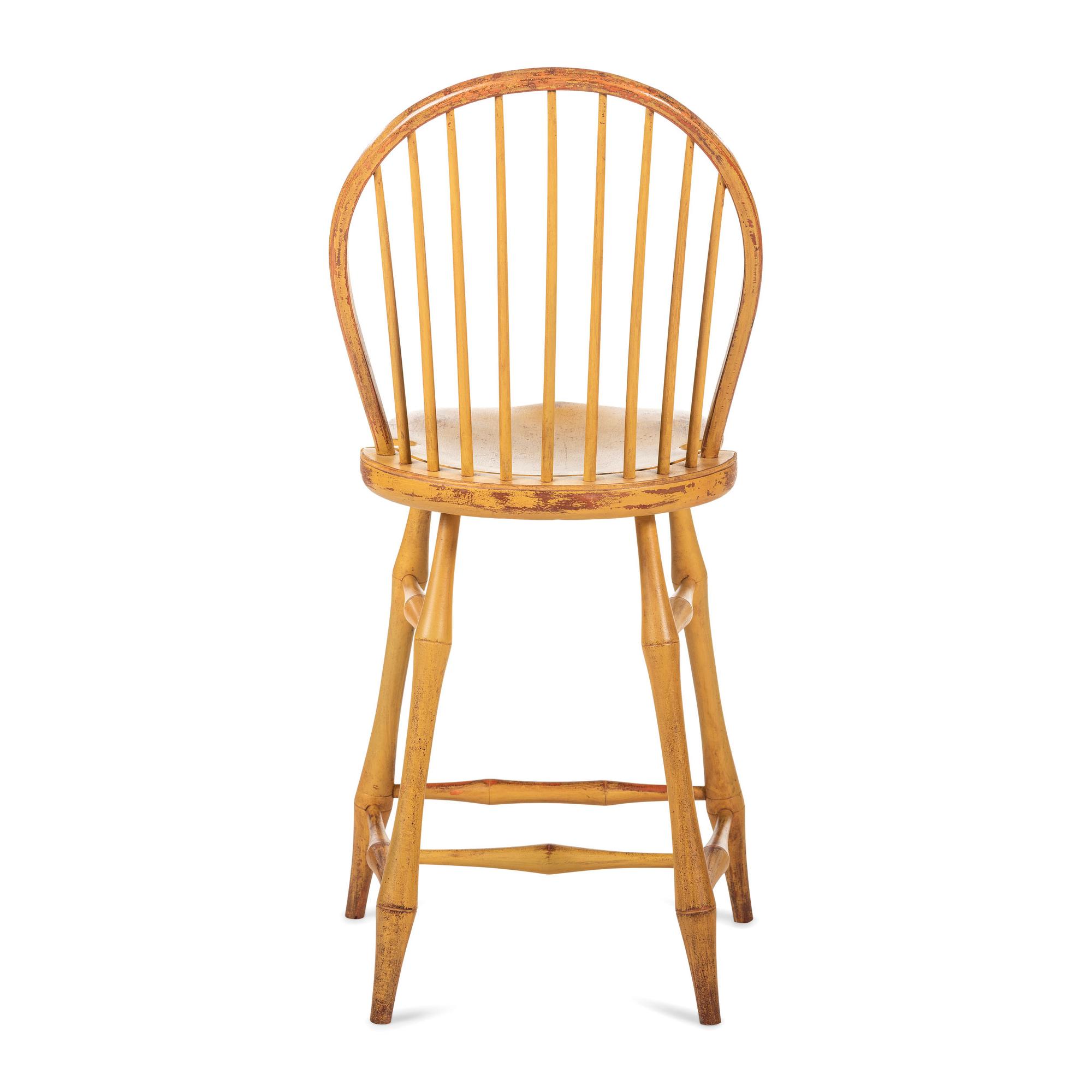 A Yellow Painted Bow Back Compass-Seat Windsor Tall Chair