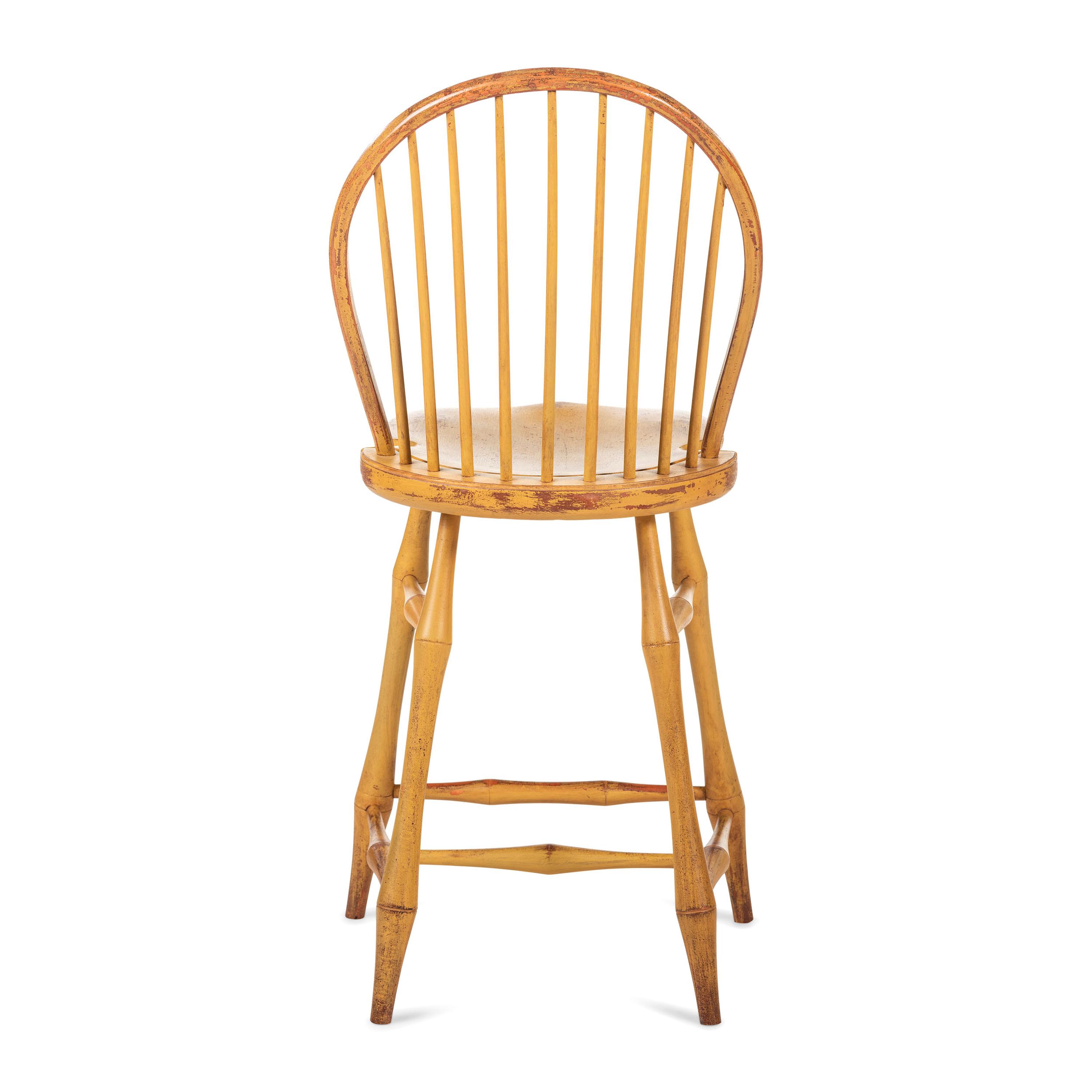 A Yellow Painted Bow Back Compass-Seat Windsor Tall Chair