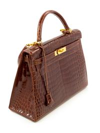 An Hermès Brown Niloticus Crocodile Sellier 32cm Kelly Handbag, 12.5" x 5" x 9.5"; Handle drop: 3.25".