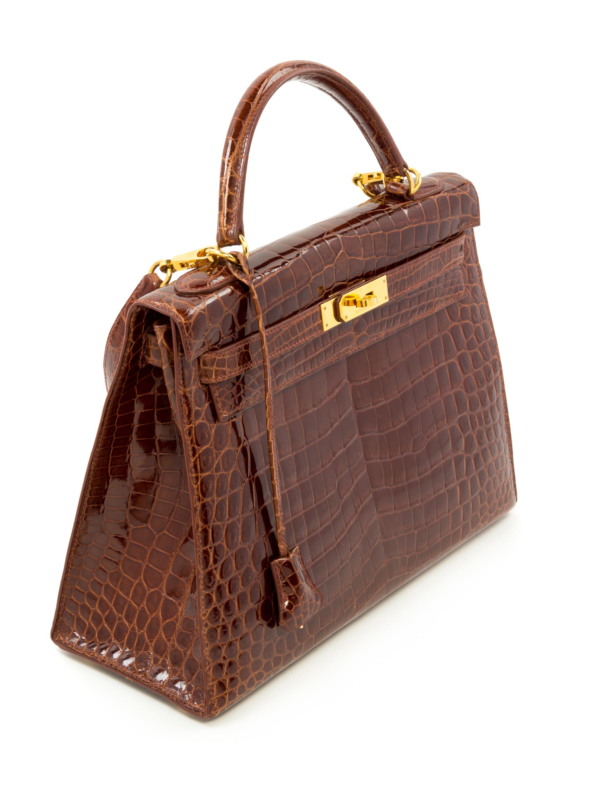 An Hermès Brown Niloticus Crocodile Sellier 32cm Kelly Handbag, 12.5" x 5" x 9.5"; Handle drop: 3.25".