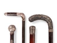 A Collection of Eight Silver and Silvered Metal Canes and Walking Sticks
