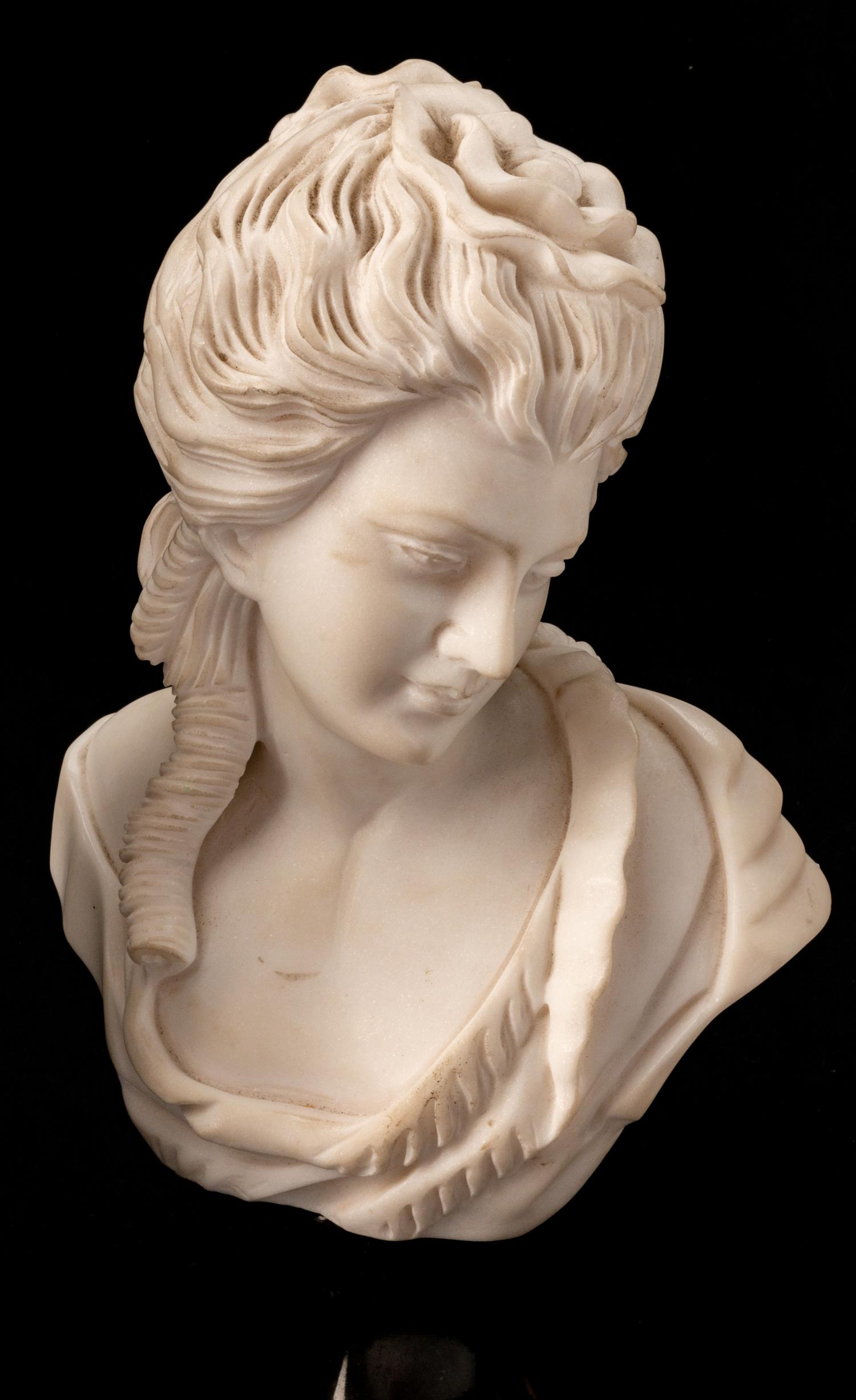 A Set of Four Italian Marble Busts of Women