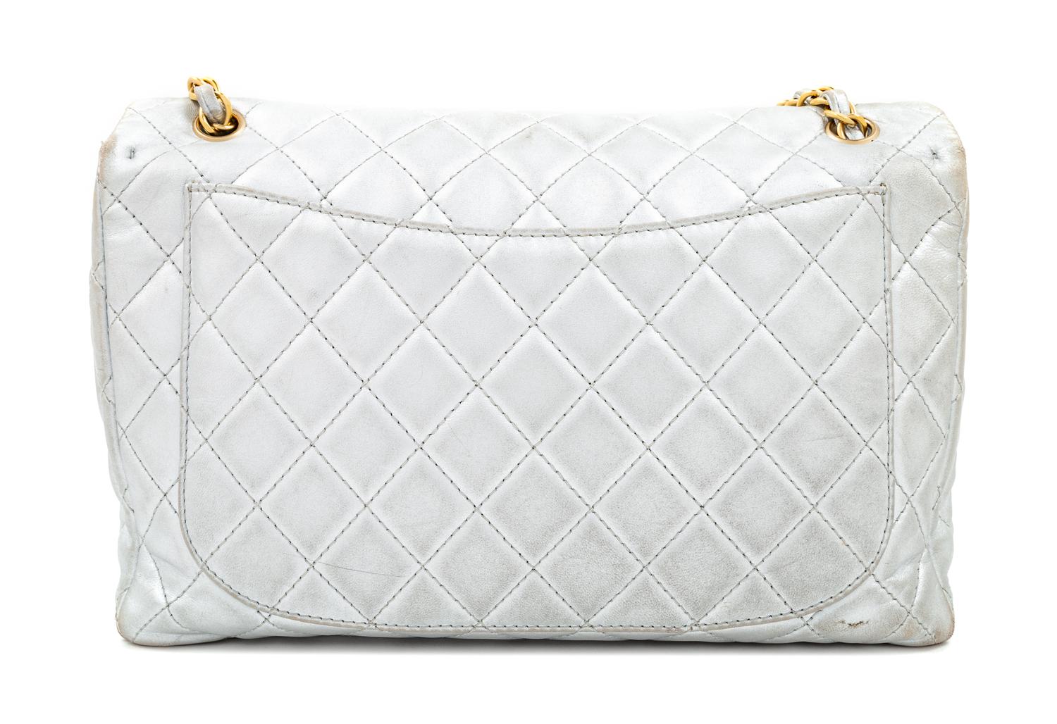 A Chanel Silver Leather Jumbo Flap Bag, 8" H x 13" W x 4" D; Strap drop: 11.5" - 20".