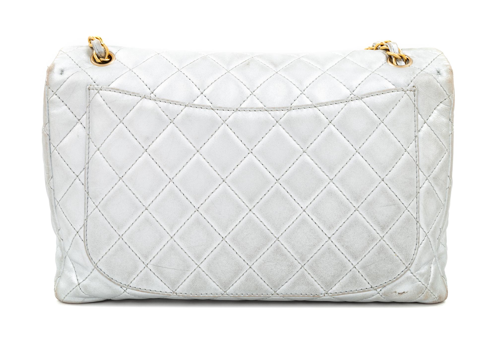 A Chanel Silver Leather Jumbo Flap Bag, 8" H x 13" W x 4" D; Strap drop: 11.5" - 20".