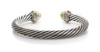 A 14 Karat Yellow Gold and Sterling Silver "Cable Classics" Bangle Bracelet, David Yurman, 28.10 dwts.