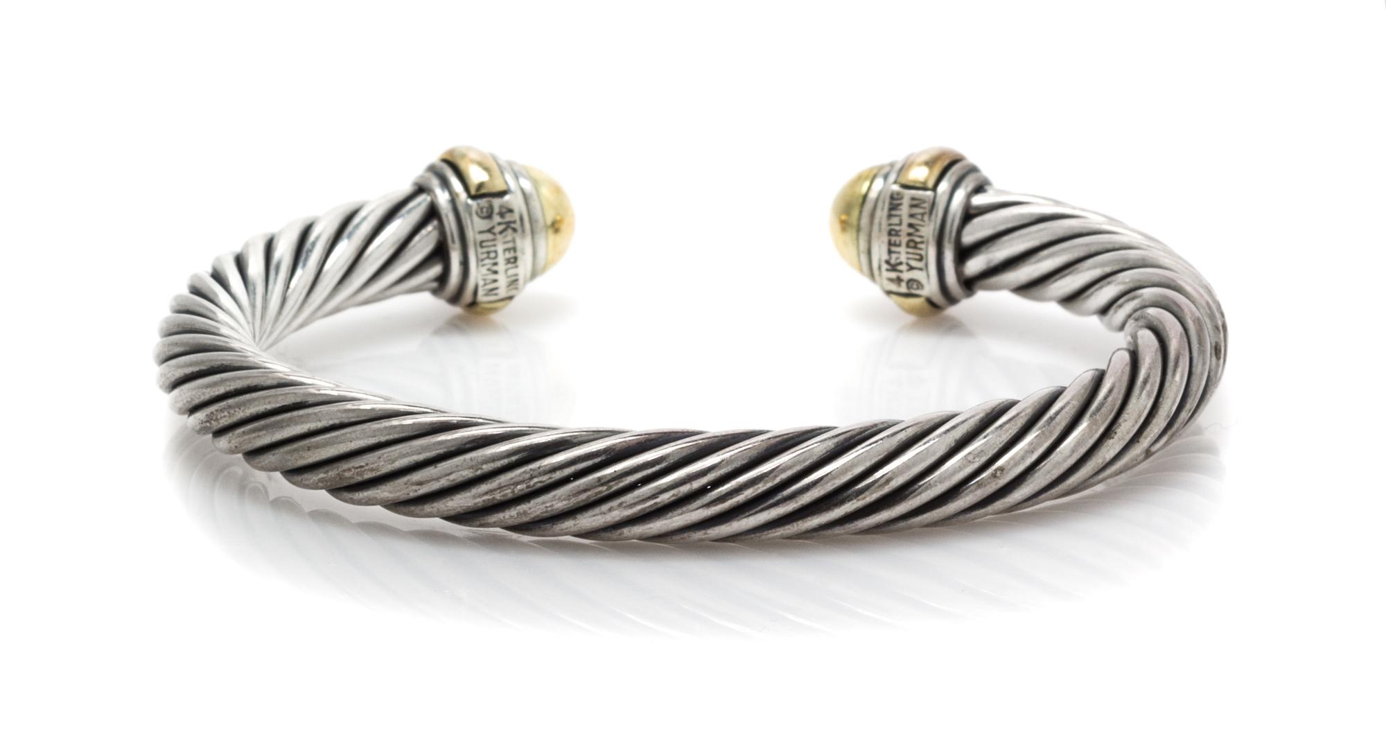 A 14 Karat Yellow Gold and Sterling Silver "Cable Classics" Bangle Bracelet, David Yurman, 28.10 dwts.
