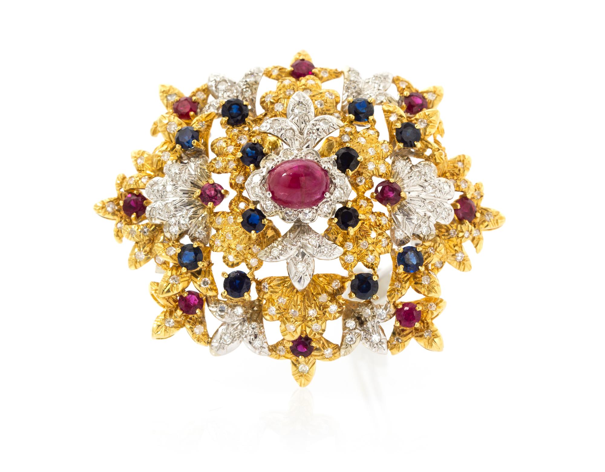An 18 Karat Gold, Ruby, Sapphire and Diamond Brooch, 18.70 dwts.