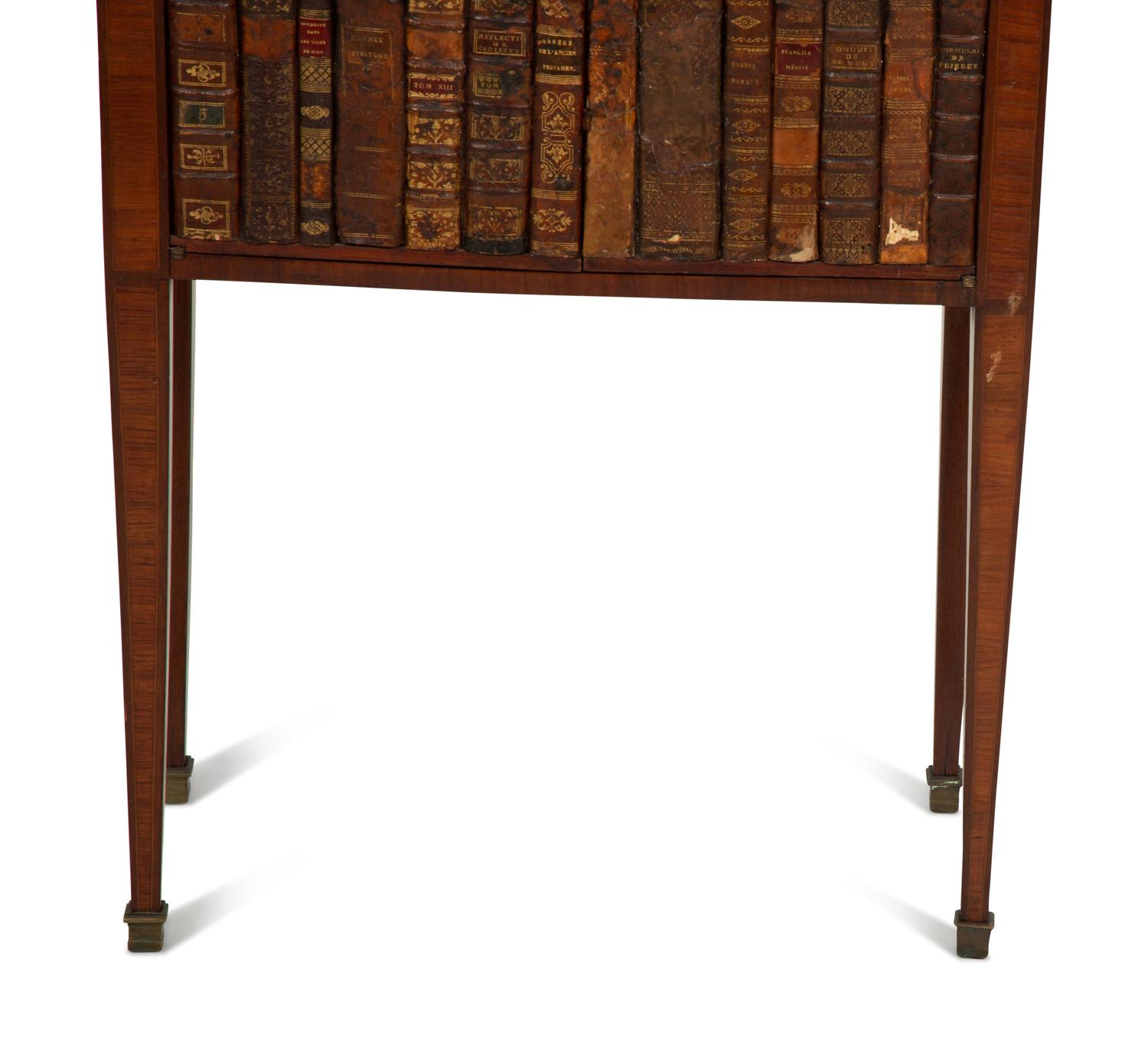 A Directoire Style Mahogany and Rosewood Small Cabinet with Faux-Leather Book Doors