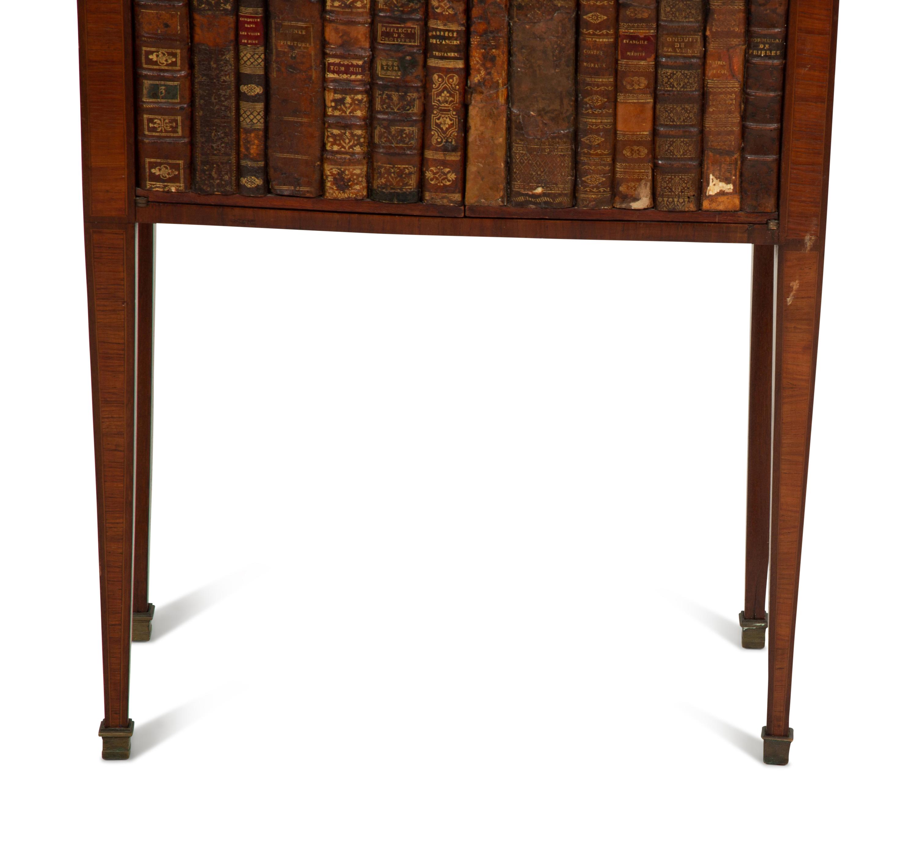 A Directoire Style Mahogany and Rosewood Small Cabinet with Faux-Leather Book Doors