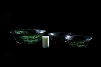 Three Chinese Spinach Jade Bowls and A Celadon Hardstone Covered Box