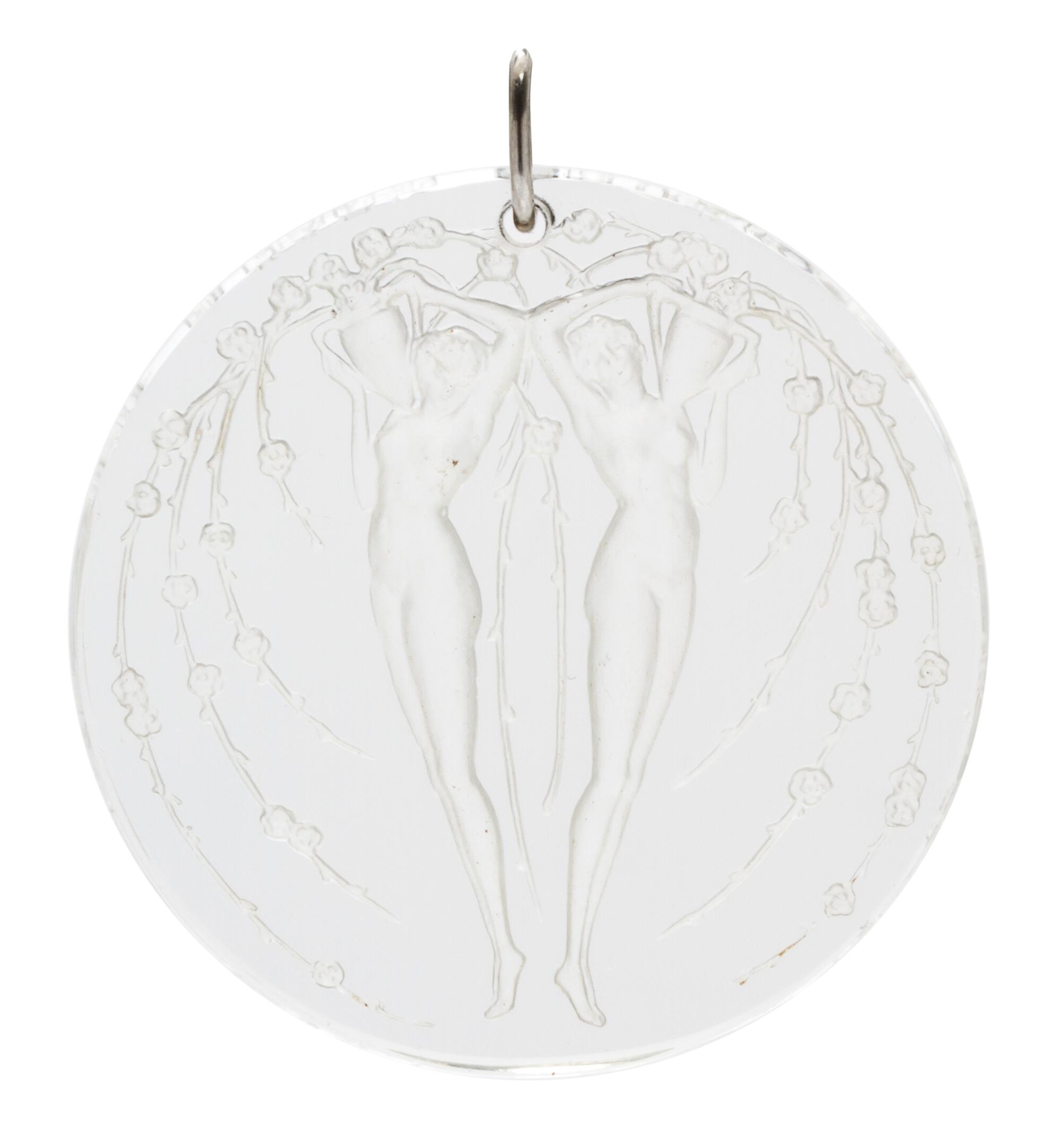 A Molded Glass and Platinum 'Deux Figurines Et Fleurs' Pendant, Rene Lalique,