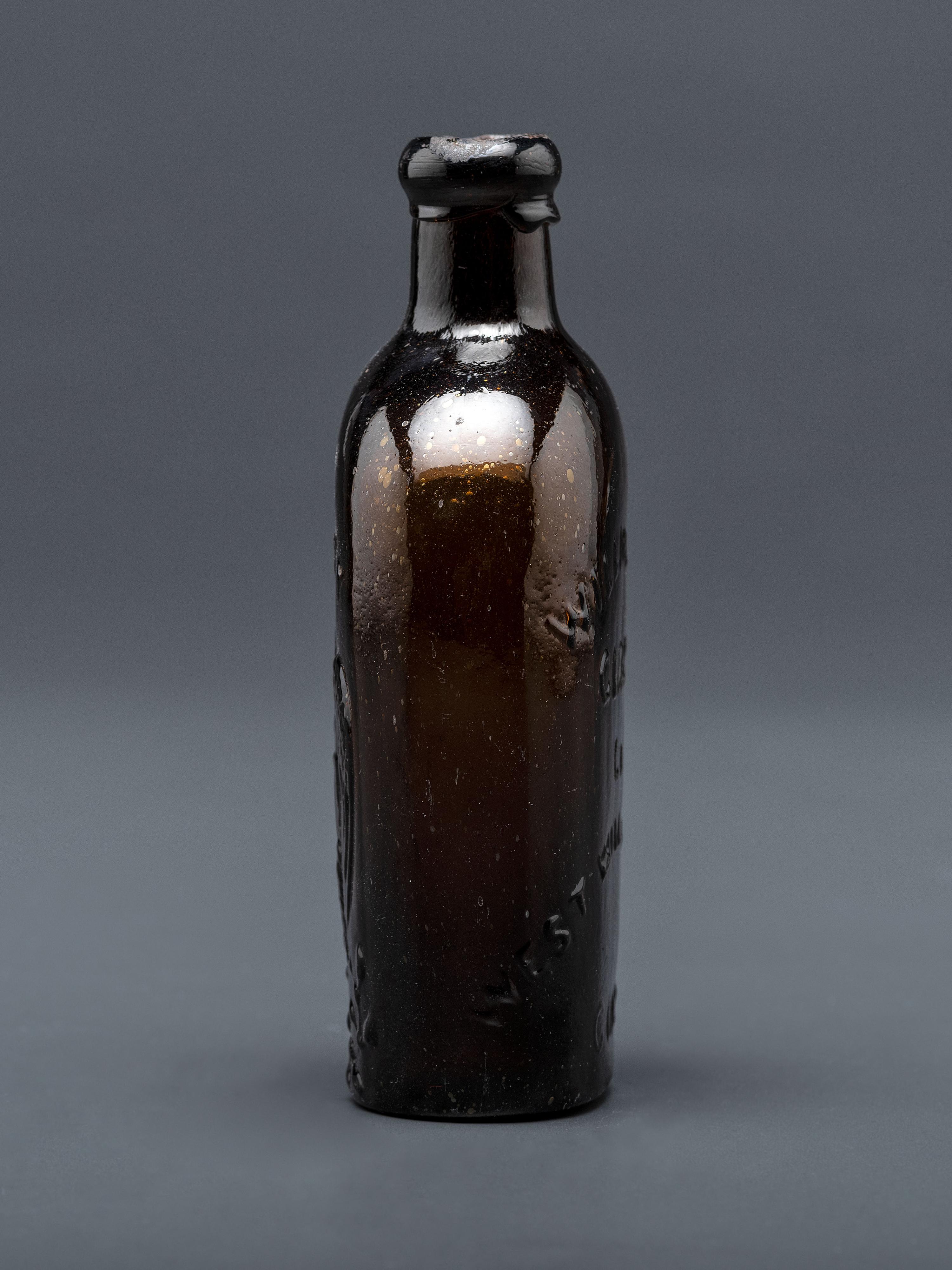 A Molded-Glass Flask in Amber by Willington Glass Company, Connecticut