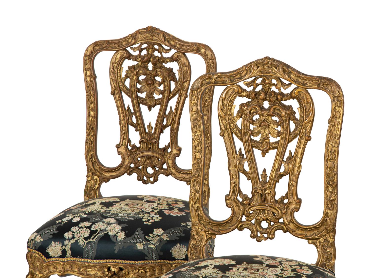 A Set of Four French Rococo Style Carved Gilt Wood Side Chairs