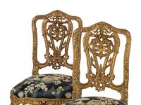 A Set of Four French Rococo Style Carved Gilt Wood Side Chairs
