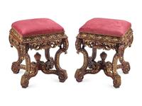 A Pair of Régence Style Carved and Parcel Gilt Stools