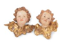A Pair of Continental Painted and Parcel Gilt Putto Masks