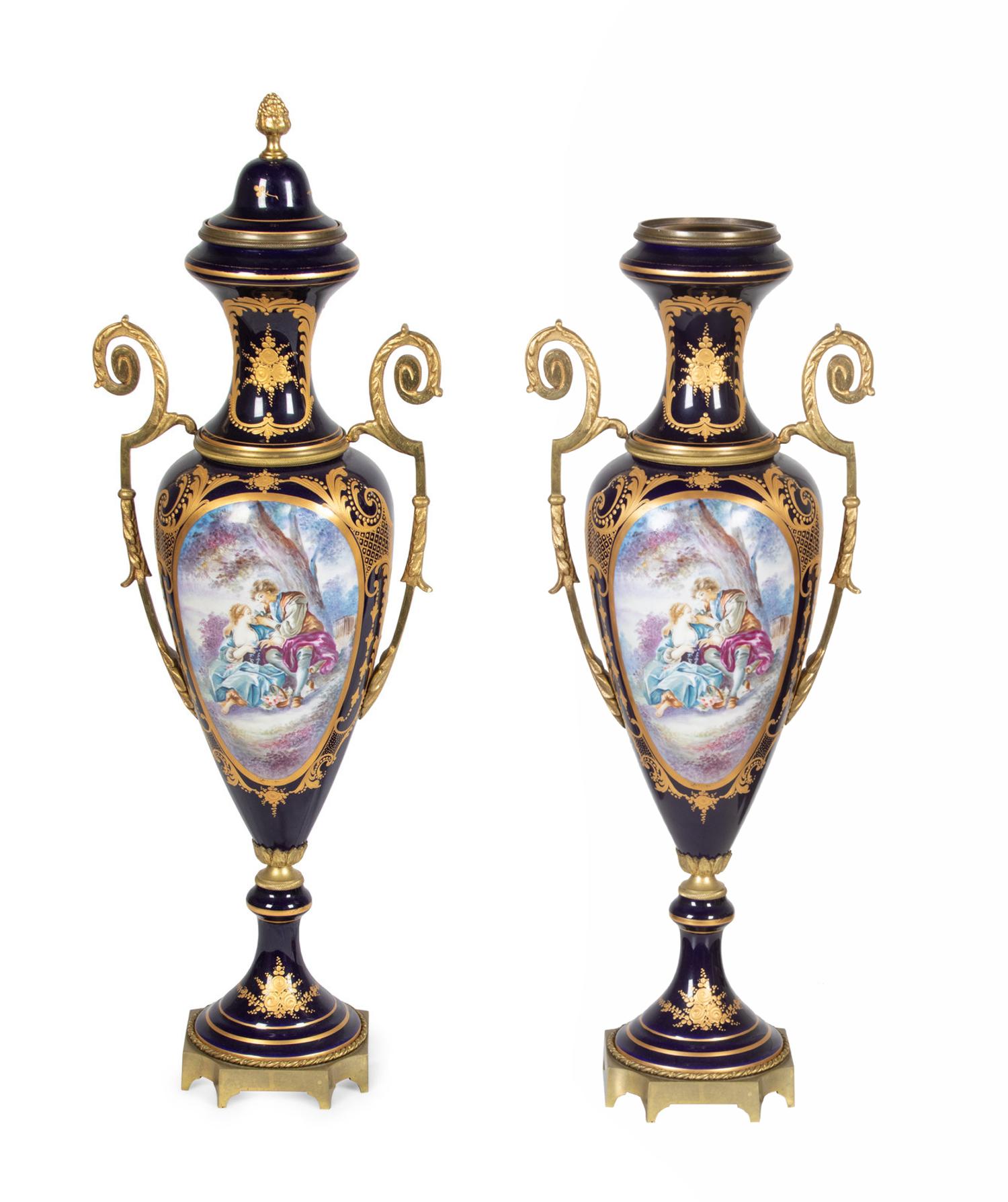 A Pair of Sèvres Style Gilt Metal Mounted Porcelain Covered Urns