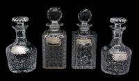 Four Cut Glass Decanters with English Silver Labels Height of tallest 10 inches. — 20TH CENTURY