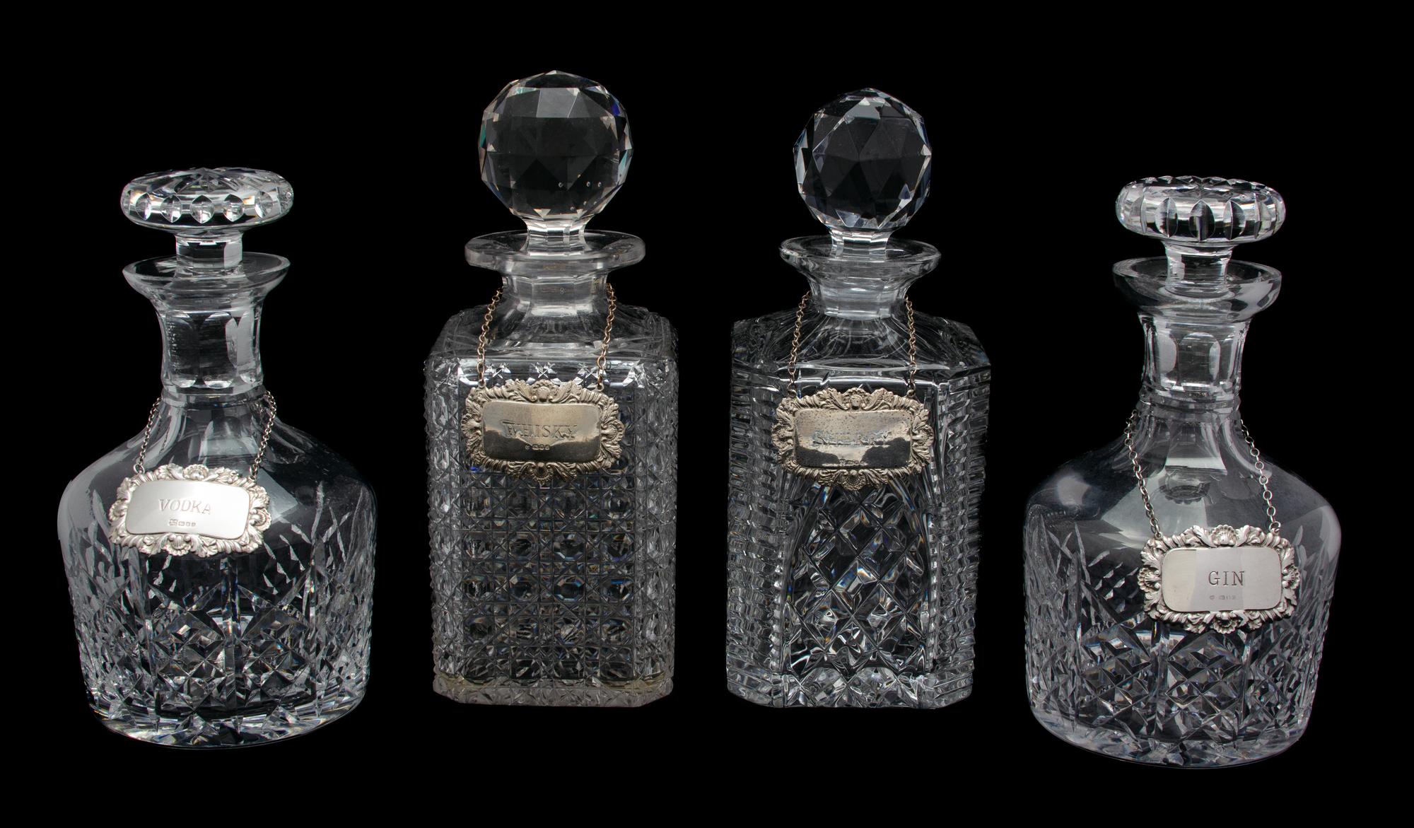Four Cut Glass Decanters with English Silver Labels Height of tallest 10 inches. — 20TH CENTURY